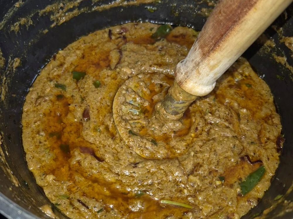 Curry cooking in a large pot
